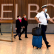 A Qantas flight crew arrive at Melbourne’s Tullamarine Airport on November 29, 2021.